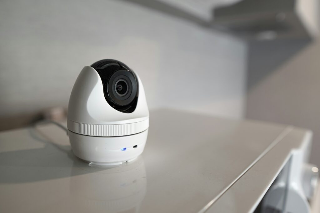 A home camera mounted on a shelf